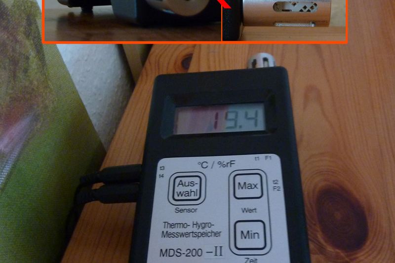 Handheld moisture meter used during damp assessment